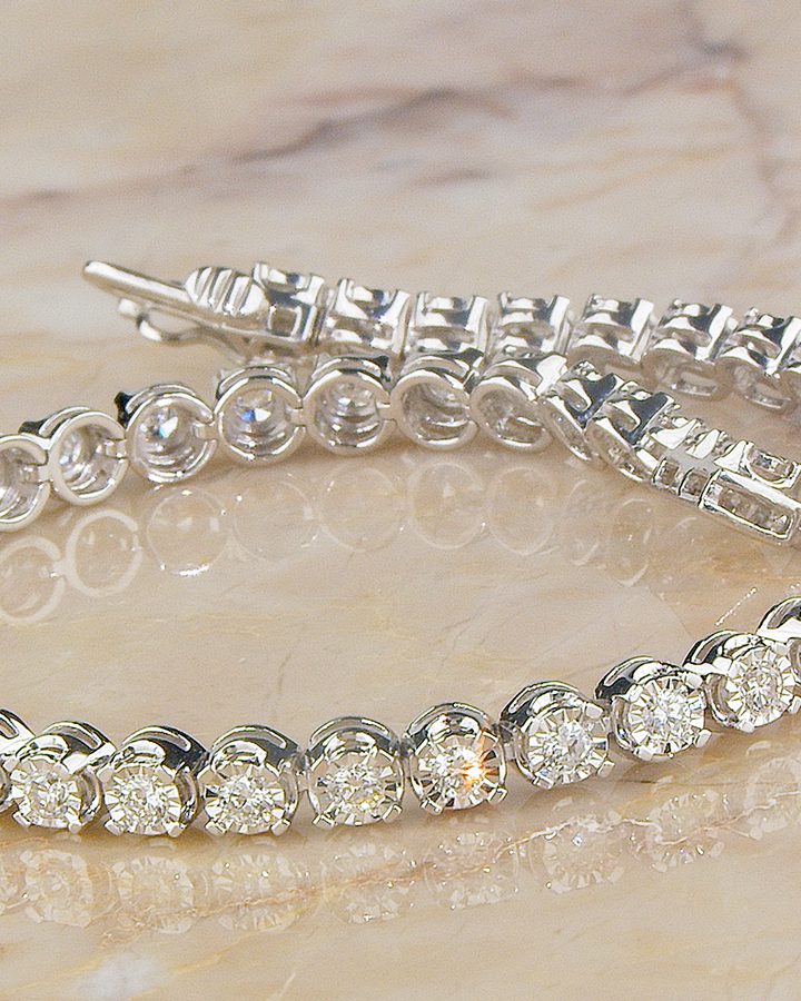 Illusion-set tennis bracelet on marble